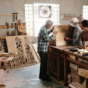 carpenter-examining-finished-wooden-board-2023-11-27-05-06-50-utc-scaled-1.jpg