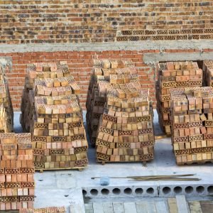 neat-stacks-of-red-bricks-lit-by-summer-sun-piled-2024-06-14-05-09-23-utc-scaled-1.jpg