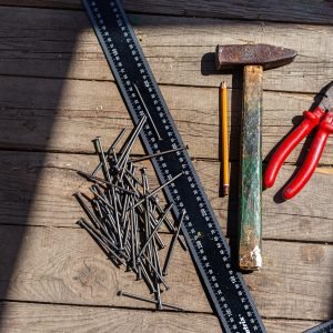 old-construction-tools-nails-a-hammer-a-pencil-2023-11-27-05-24-34-utc-scaled-1.jpg