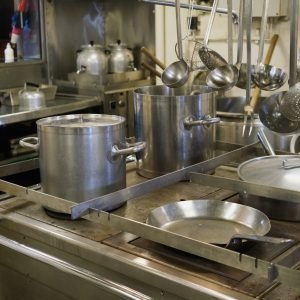 steel-saucepans-and-casseroles-in-an-industrial-k-2023-11-27-05-21-57-utc-scaled-1.jpg