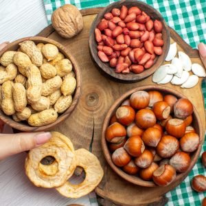 top-view-fresh-raw-hazelnuts-with-peanuts-on-white-2023-11-27-05-06-05-utc-scaled-1.jpg